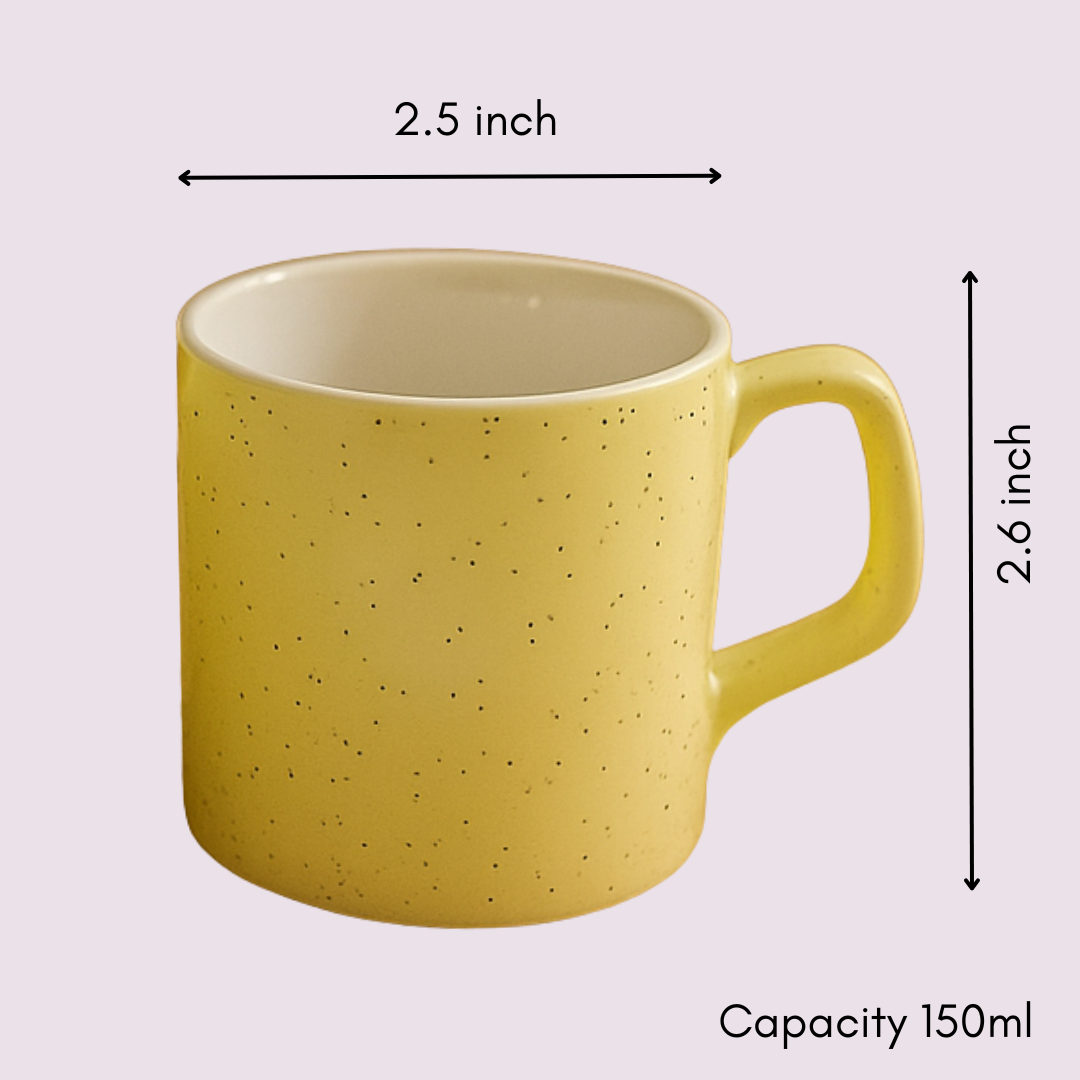 Close-up of a single yellow ceramic mug with height and width measurements.