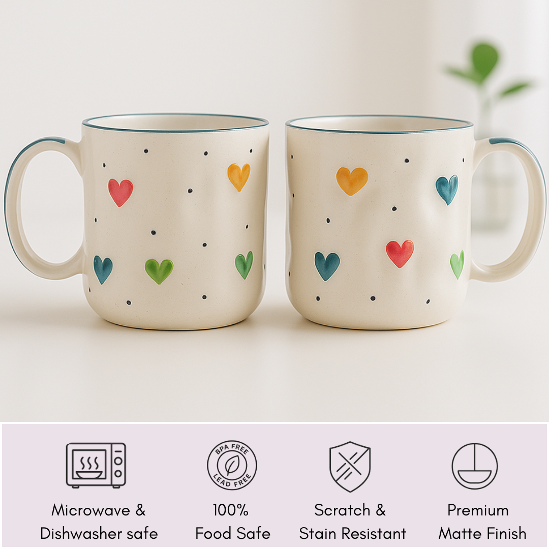 Set of 2 IndoCasa ceramic mugs with colorful heart design and icons for food-safe, microwave-safe, scratch-resistant.