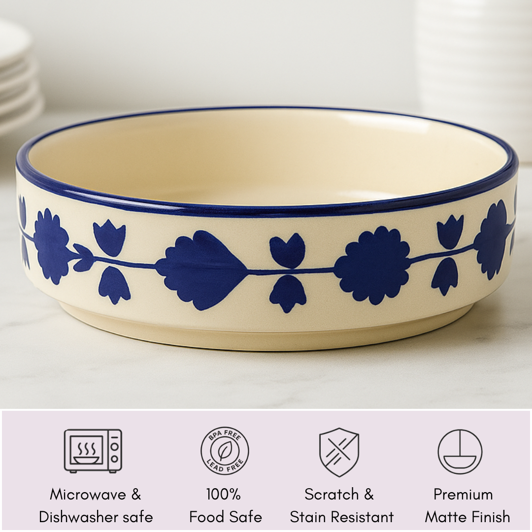 Blue floral ceramic bowl displayed with icons denoting microwave safe, food safe, scratch resistant, and matte finish.